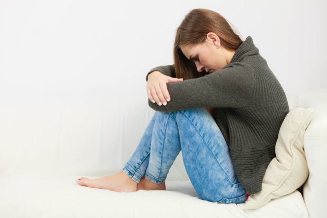 Girl seating on bed