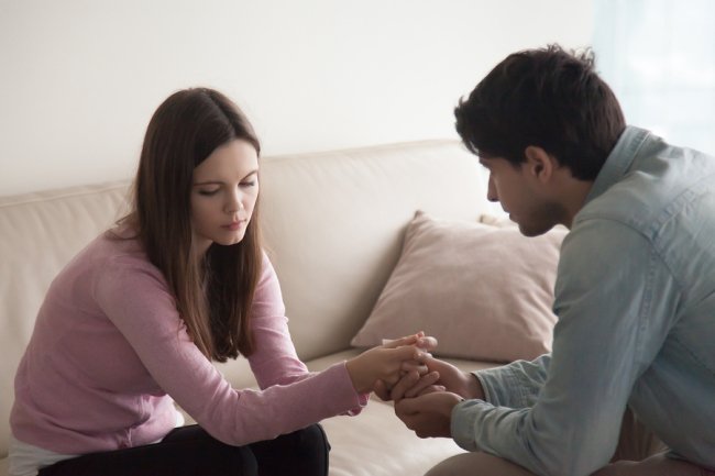 A boy talking to a girl