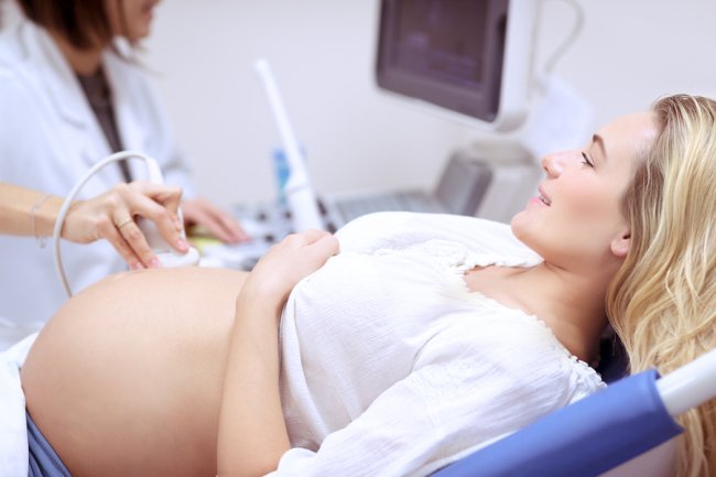 Doctor checking the patient through ultrasound